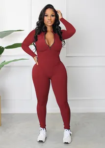 Burgundy ribbed long sleeve jumpsuit with front zipper for athletic and casual wear