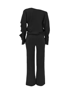 Back view of black two-piece set with ripped sleeves and wide-leg pants