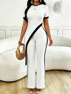 Chic white two-piece set featuring a contrast trim top and matching wide-leg pants