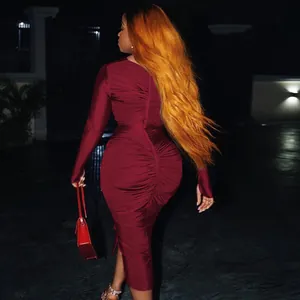 Back view of sexy burgundy long sleeve ruched bodycon midi dress with elegant fit.