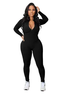Detailed studio view of black ribbed long-sleeved jumpsuit with front zipper closure.