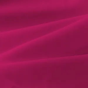 Gedetailleerde macro-opname van de magenta stoftextuur voor effen dameskleding set