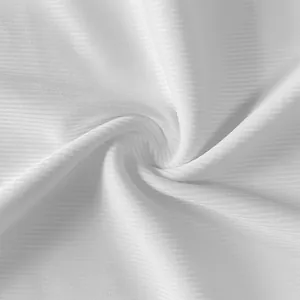Macro close-up view of premium white ribbed fabric texture for summer slim fit dress