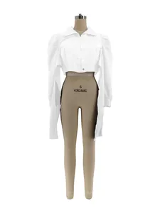Detail view of a white cropped puff shoulder shirt on a mannequin with lapel collar