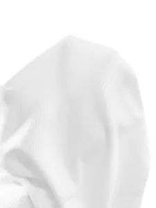 Close-up of high-quality white ribbed knit fabric texture for summer dress
