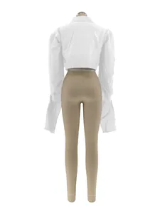 Detailed back view of a white puff sleeve cropped shirt displayed on a mannequin