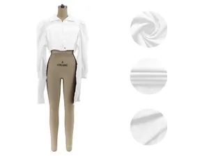 Detailed view of white cropped puff shoulder shirt with fabric texture close-ups