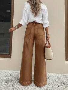 Detailed back view of women's vintage brown wide-leg jeans with a high-waist straight fit