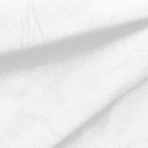 Macro detail showing the high-quality white woven fabric texture for women's shirt