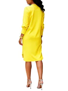 Elegant back view of a vibrant yellow long-sleeve midi dress worn by a model on white