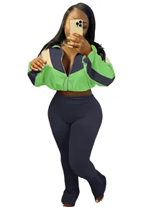 Two-piece sports set featuring color-block zip-up jacket and tight leggings