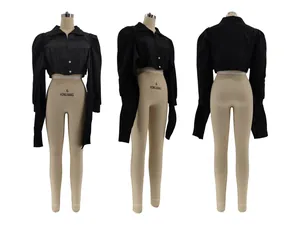 Detail view showing front, side and back of a black cropped puff shoulder shirt.
