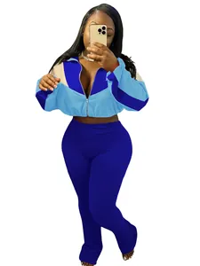 Sporty two-piece tracksuit set with a color-block zip-up jacket and tight leggings.
