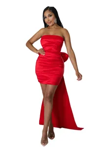 Detailed view of red strapless pleated mini dress with elegant oversized back bow