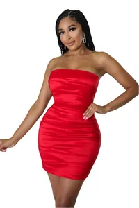 Detail of red strapless ruched bodycon mini dress showing satin texture and slim fit