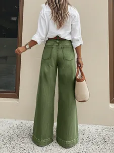 Back view of vintage washed green wide-leg denim jeans featuring casual loose fit style