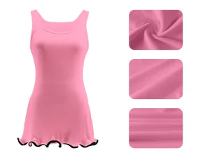 Close-up of pink ribbed fabric and wavy hem detail on a sleeveless summer vest dress.