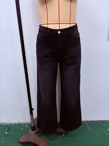 Vintage washed black wide-leg denim jeans for women shown on a fashion mannequin