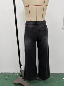 Detailed back view of vintage washed black wide-leg denim jeans on a tailor mannequin