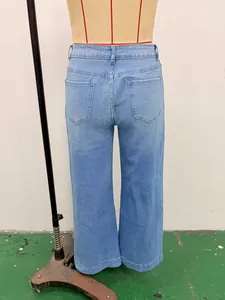 Detailed back view of vintage light blue washed wide-leg denim jeans on a mannequin