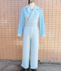 Elegant light blue jumpsuit with pleated long sleeves and a sophisticated blazer collar detail