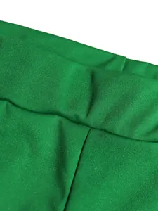 Close-up detail of vibrant green sports fabric showing stitching and texture.
