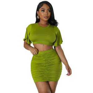 Sexy two-piece set featuring a green crop top with flutter sleeves and a ruched skirt