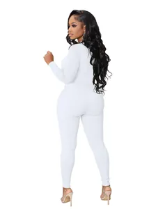 Full back view of a slim fit white ribbed long sleeve sports jumpsuit for women
