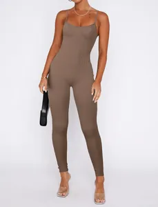 Full view showing the ribbed texture and tight fit of the brown backless jumpsuit
