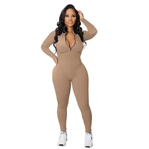 Full view of a khaki ribbed long-sleeve jumpsuit with a front zipper on a model.