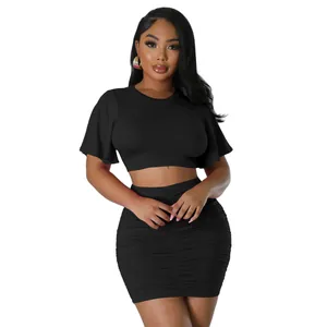 Stylish sexy black two-piece set featuring a ruffled crop top and ruched mini skirt.