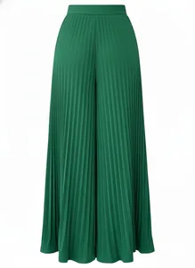 Close-up detail of high-waisted pleated wide-leg trousers in elegant emerald green