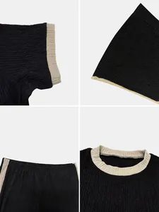 Detailed views of black textured crop top and wide-leg pants set with beige trim