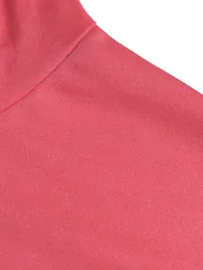 Close-up of pink sport fabric showing high-quality texture and stitching detail.