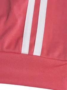 Close-up of pink fabric texture and white stripe design on women's sports tracksuit