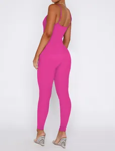 Back view of a hot pink ribbed jumpsuit with spaghetti straps and open back detail