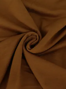 Macro view of the soft brown knit fabric texture showing material detail clearly