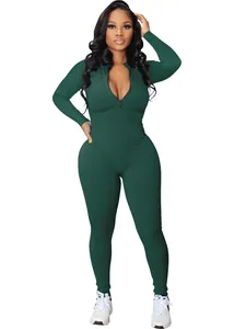 Full view of dark green ribbed long sleeve jumpsuit with front zipper detail