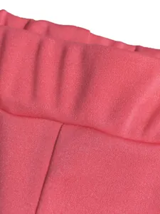 Detailed macro view of the coral pink elastic waistband texture on casual sports pants