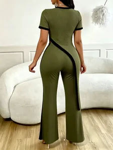 Back view of army green ribbed two-piece set featuring asymmetric cut-out top and flared pants