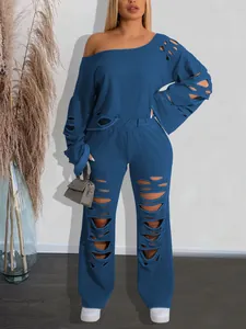 Model wearing blue distressed loungewear set showing the ripped details and loose fit