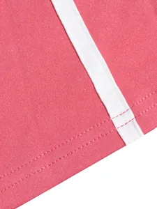 Close-up detail of high-quality stitching and fabric on pink striped sports set