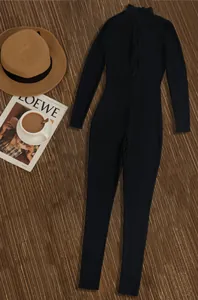 Stylish black ribbed long sleeve athletic jumpsuit with front zipper shown in flat lay