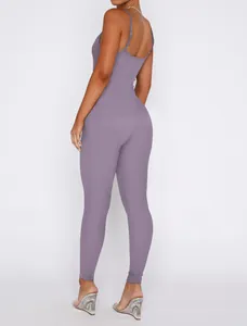 Back view of a mauve ribbed knit jumpsuit with slim straps and an open back design.