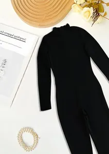Elegant black mock neck long sleeve bodysuit jumpsuit featuring a fine ribbed texture