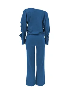 Back view detail of a casual blue two-piece lounge set with ripped sleeve accents and soft fabric.