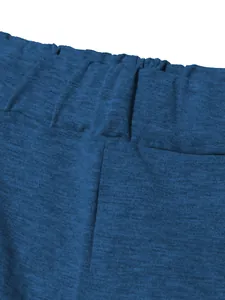 Close-up macro view of the elasticated waistband on navy blue sporty sweatpants