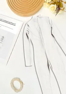 Close-up detail of off-white ribbed athletic long-sleeved jumpsuit featuring a back zipper