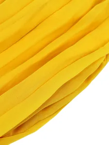 Detailed macro view of yellow pleated fabric showing soft texture and premium drape