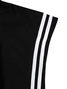 Macro view showing the white triple stripe design on black athletic sports T-shirt fabric